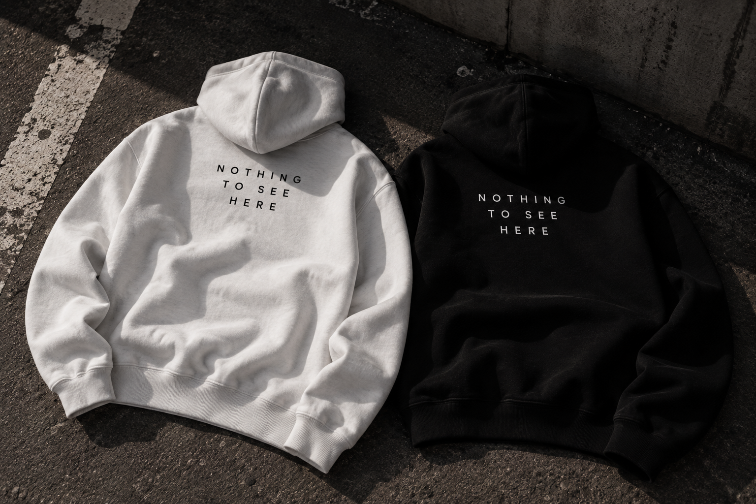 NOTHING TO SEE HERE Heavy Hoodie in black and white
